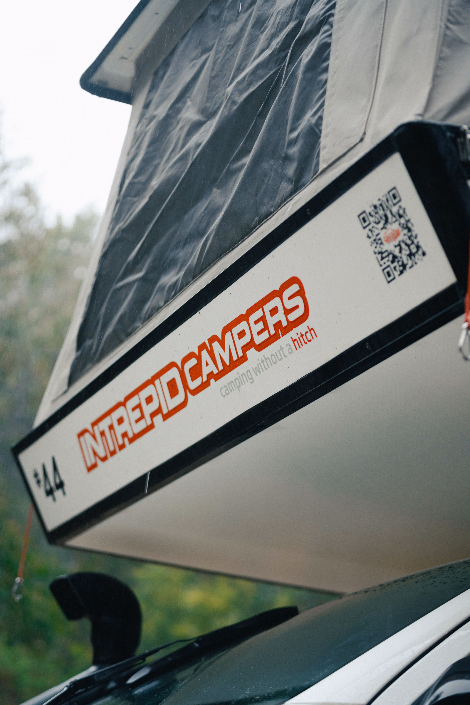 Close-up of an Intrepid Campers canopy in a forest