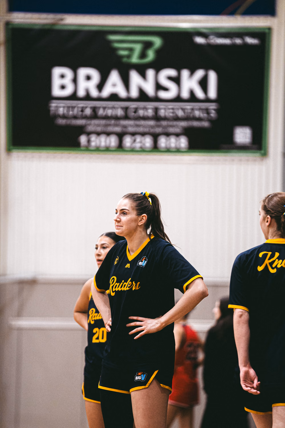 Knox Raiders basketball player standing courtside during a game